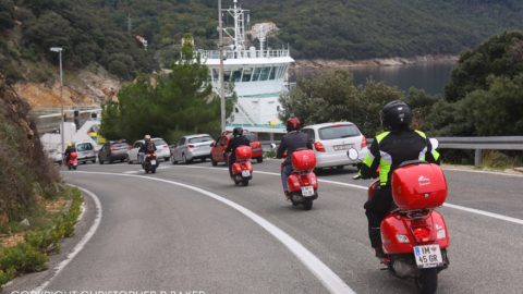 Vespas approach ferry to Krk on Croatia by Scooter tour with Edelweiss Bike Travel; copyright Christopher P Baker