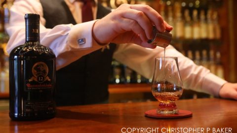 Pouring malt whisky in the bar at The Torridon luxury hotel, Torridon, Scotland; copyright Christopher P Baker