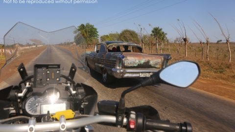 BMW R1200GS passing a 1950s Oldsmobile in Cuba; copyright Christopher P Baker